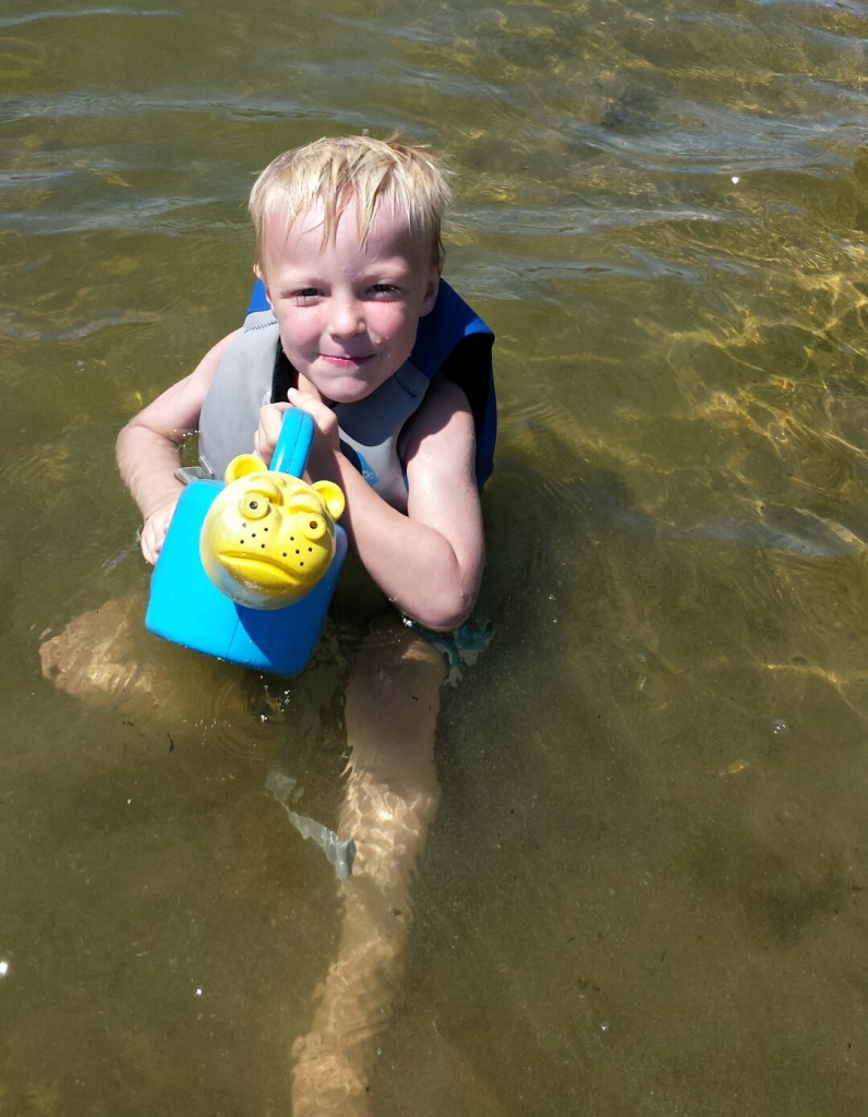 James smiling with hippo bucket