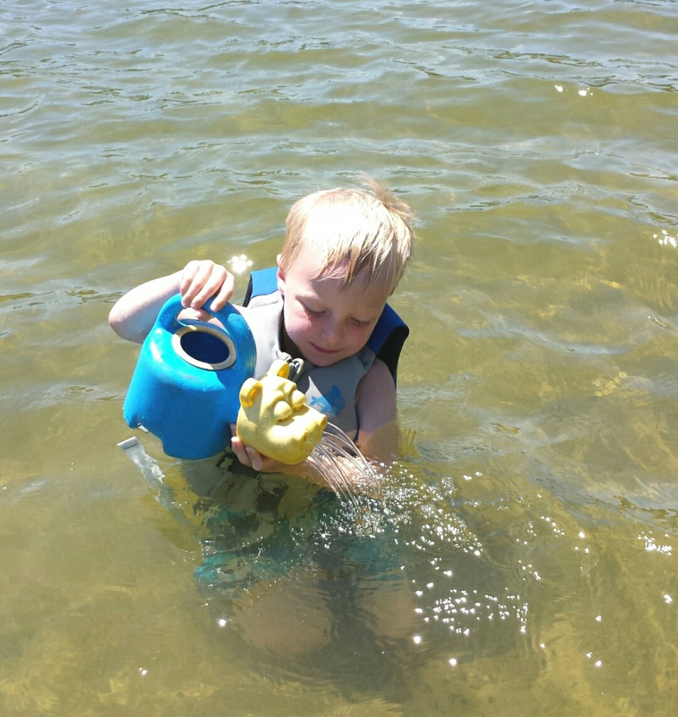 james pouring hippo bucket